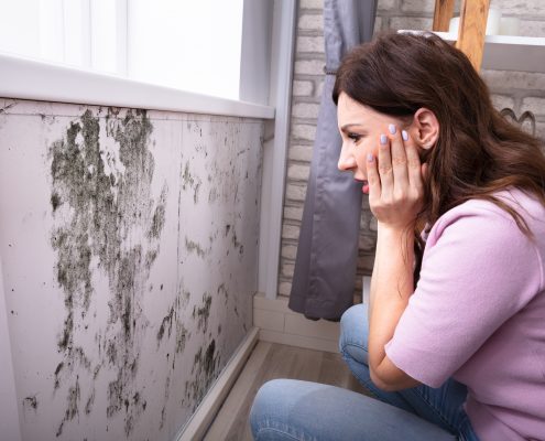 Shocked Woman Looking At Mold mycotoxins